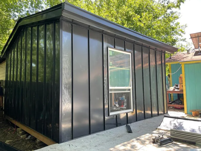 Black standing seam metal wall panels for Roof Inspection in Castroville