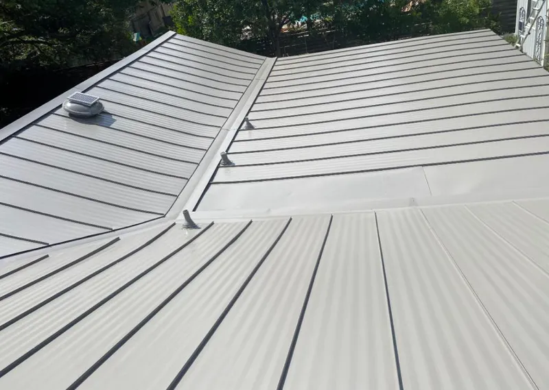 Solar attic fan installed on a metal roof for Roof Ventilation in Castroville